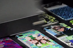 Smartphone covers being printed with the Roland VersaUV LEF-20 Benchtop UV flatbed printer.
