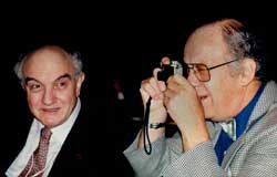 Les Brener looks on as Alan Michael, Michaels Camera Video & Digtal, Melbourne,  snaps a picture at PMA in Melbourne, circa 1995. (Pic: John Swainston)