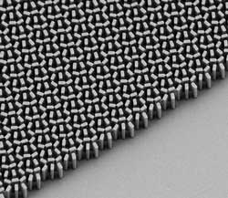 An electron microscopic view of the titanium dioxide metamaterial lens, created by engineers at Harvard University. These TiO2 towers are only 600nm in length, yet can image features traditional microscopes require lenses 6cm in length - 100,000 longer - to image. And apparently do so 30% better. John A. Paulson School of Engineering and Applied Sciences/Harvard University